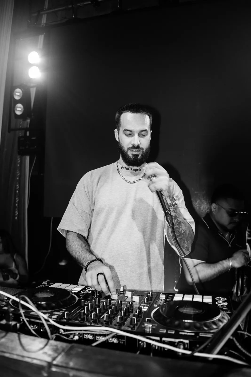 DJ Tury in the booth, black and white